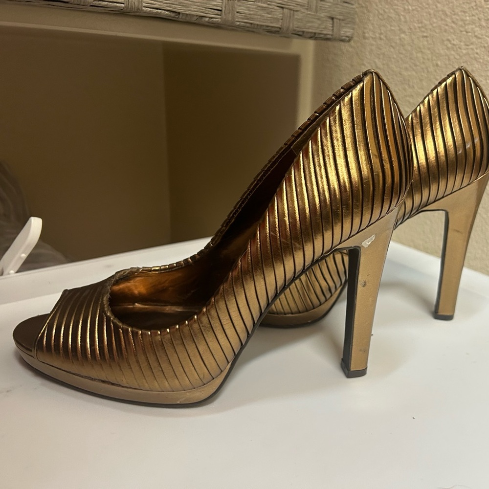 Never worn Jessica Simpson heels. 8.5. Gold. Check pictures for small detail